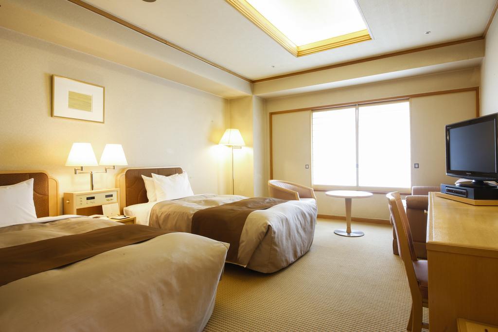 فندق تاكاياما جرين المظهر الخارجي الصورة A room at the hotel